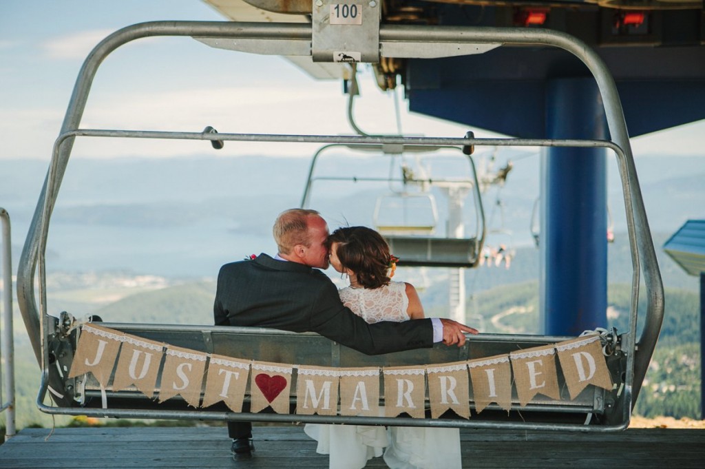 Schweitzer Mountain Sandpoint ID Wedding Photos Couple Kissing on Chairlift