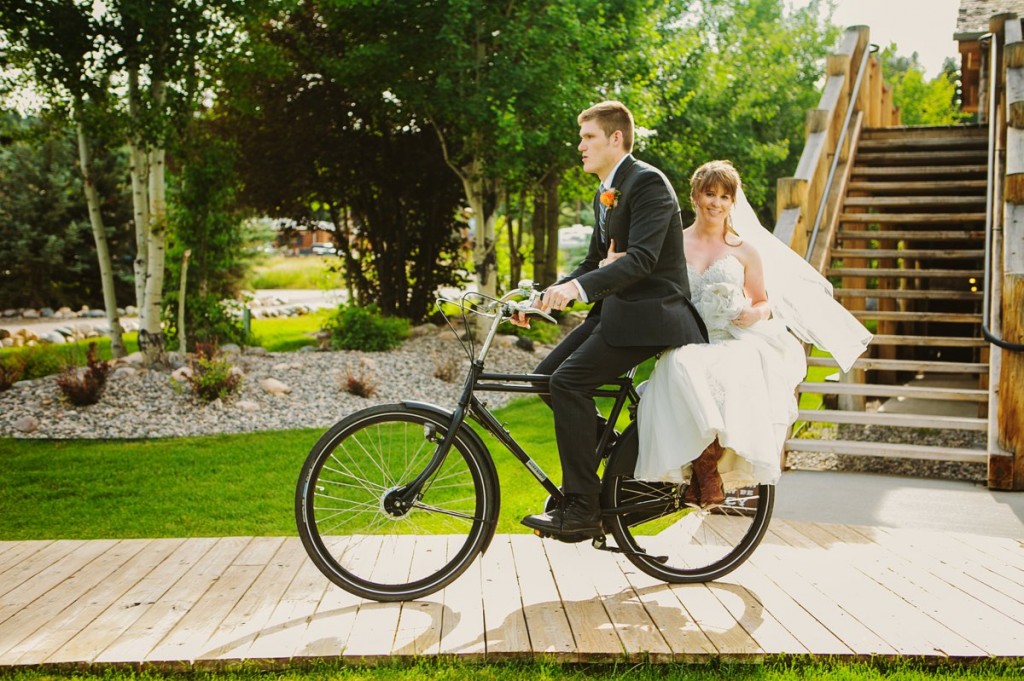 Rainbow Ranch Lodge Big Sky MT Wedding Photos Couple Riding a Bike