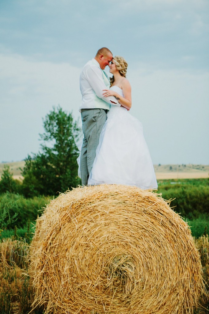Chancey's Event Center Billings MT Wedding Photos Couple on Hay Bale