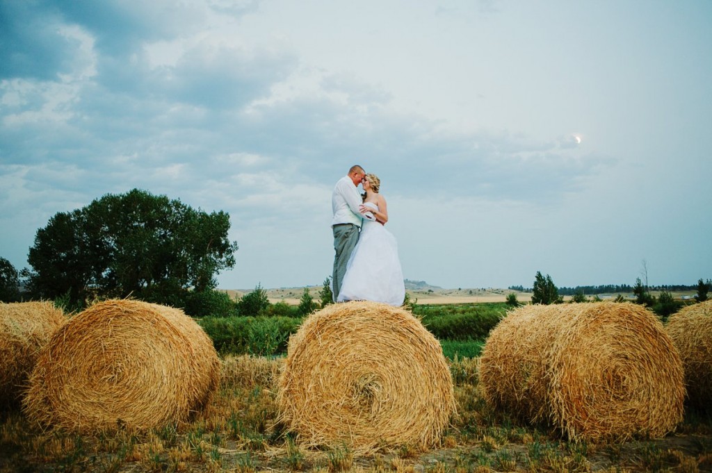 Chancey's Event Center Billings MT Wedding Photos Couple on Hay Bale