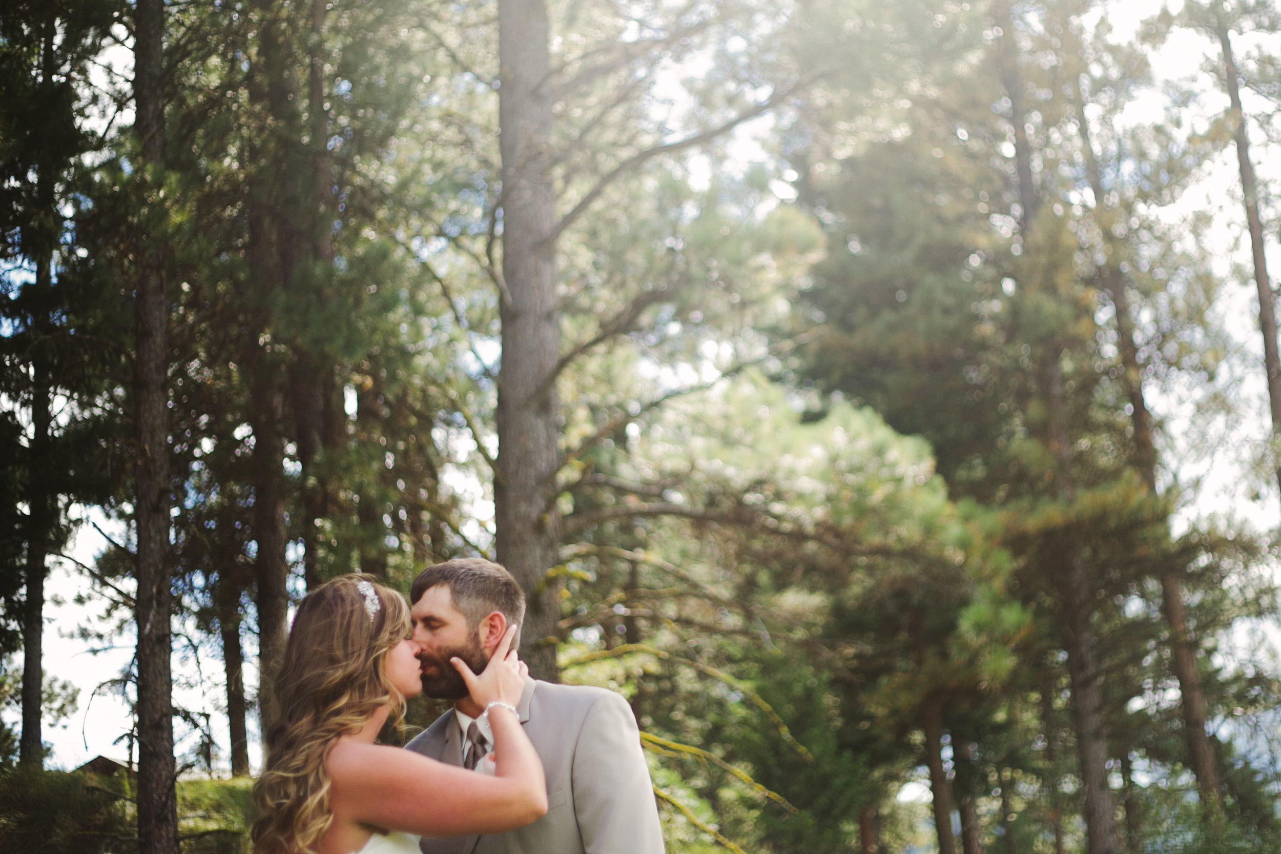 Double Arrow Resort Seeley Lake MT Wedding Photos Couple Kissing