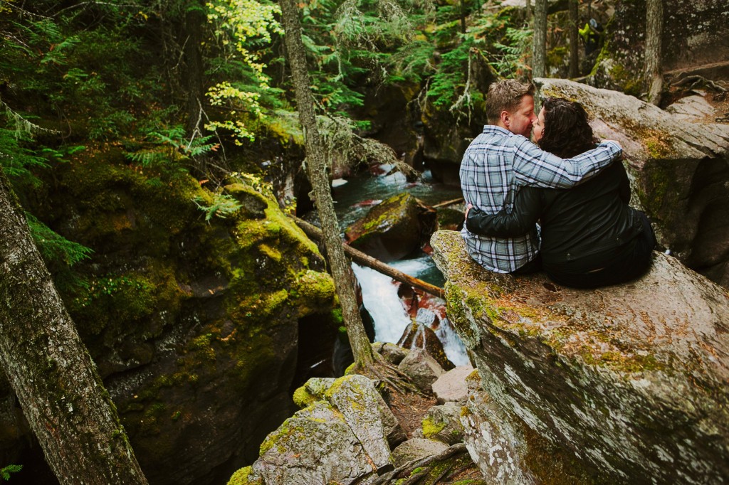 Glacier National Park Engagement Photos Couple Cuddling