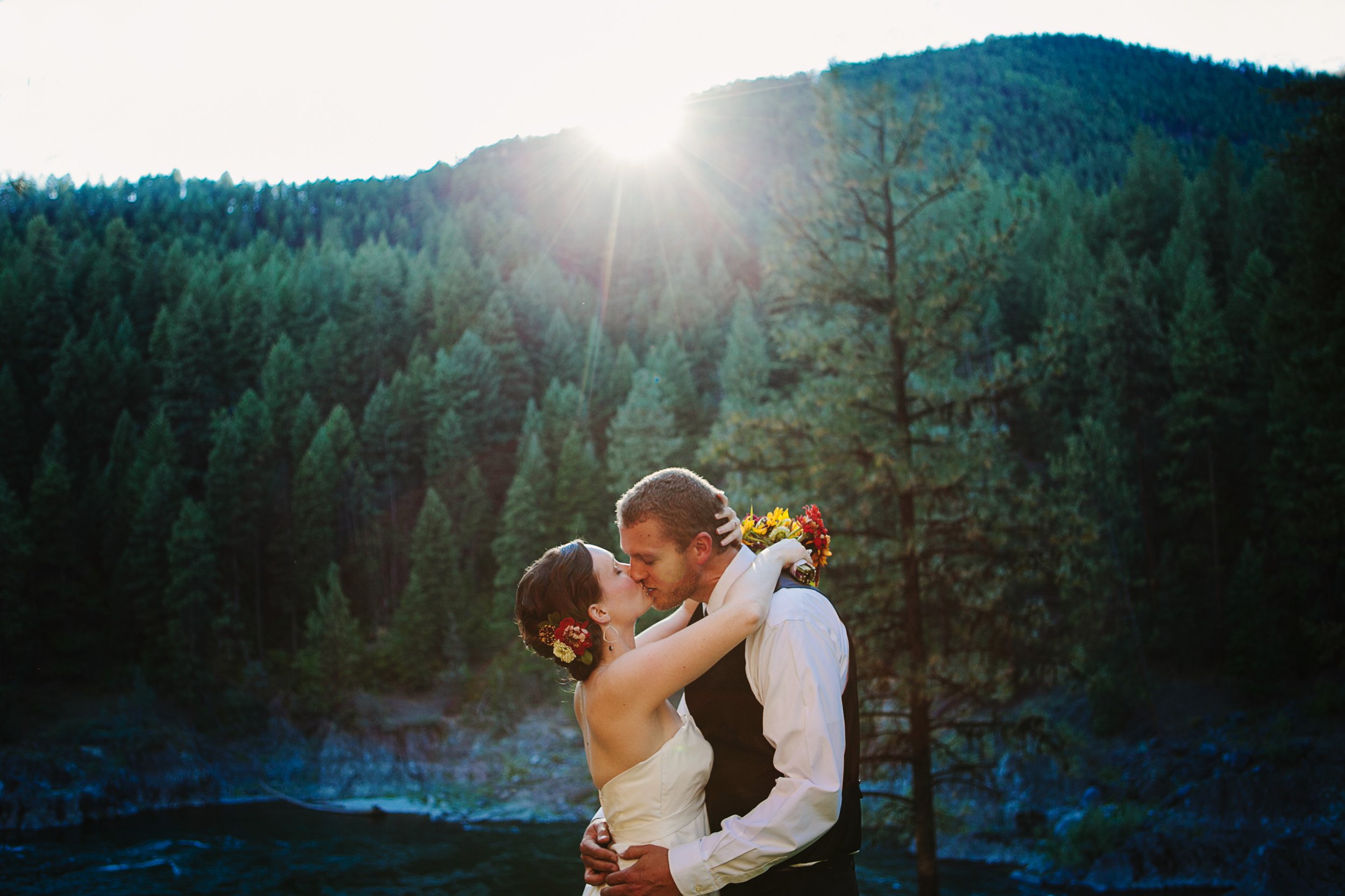 Tarkio River Lodge MT Wedding Photos Couple Kissing