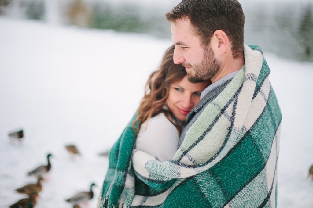 Whitefish MT Engagement Photos Couple Hugging with Blanket