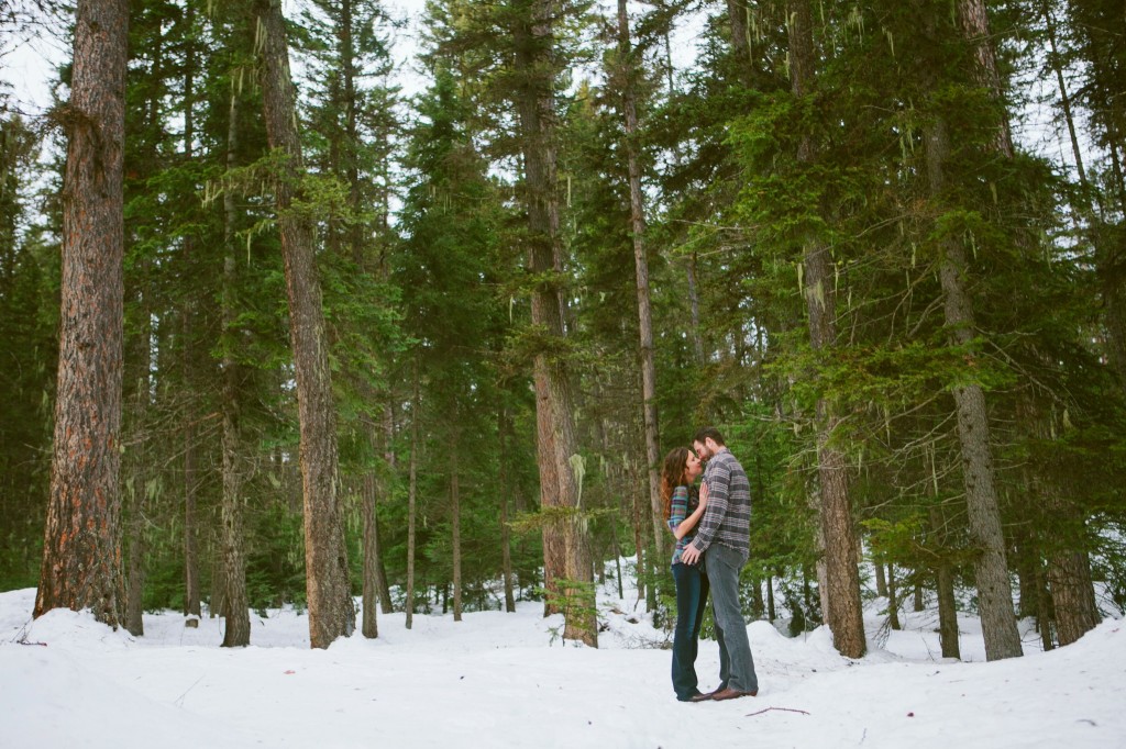 Whitefish MT Engagement Photos Couple Kissing in Woods