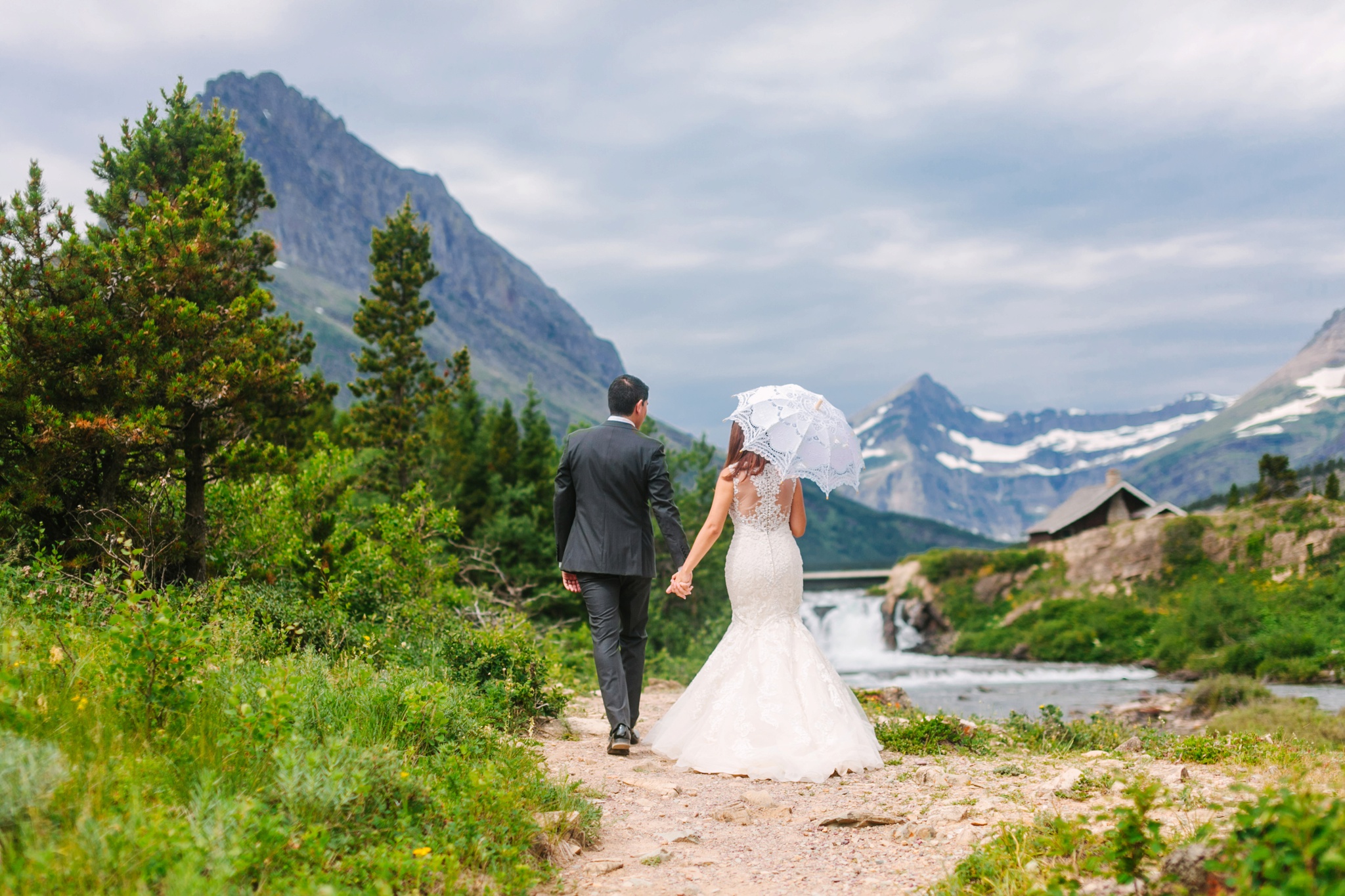Glacier National Park Many Glacier Wedding Couple Holding Hands