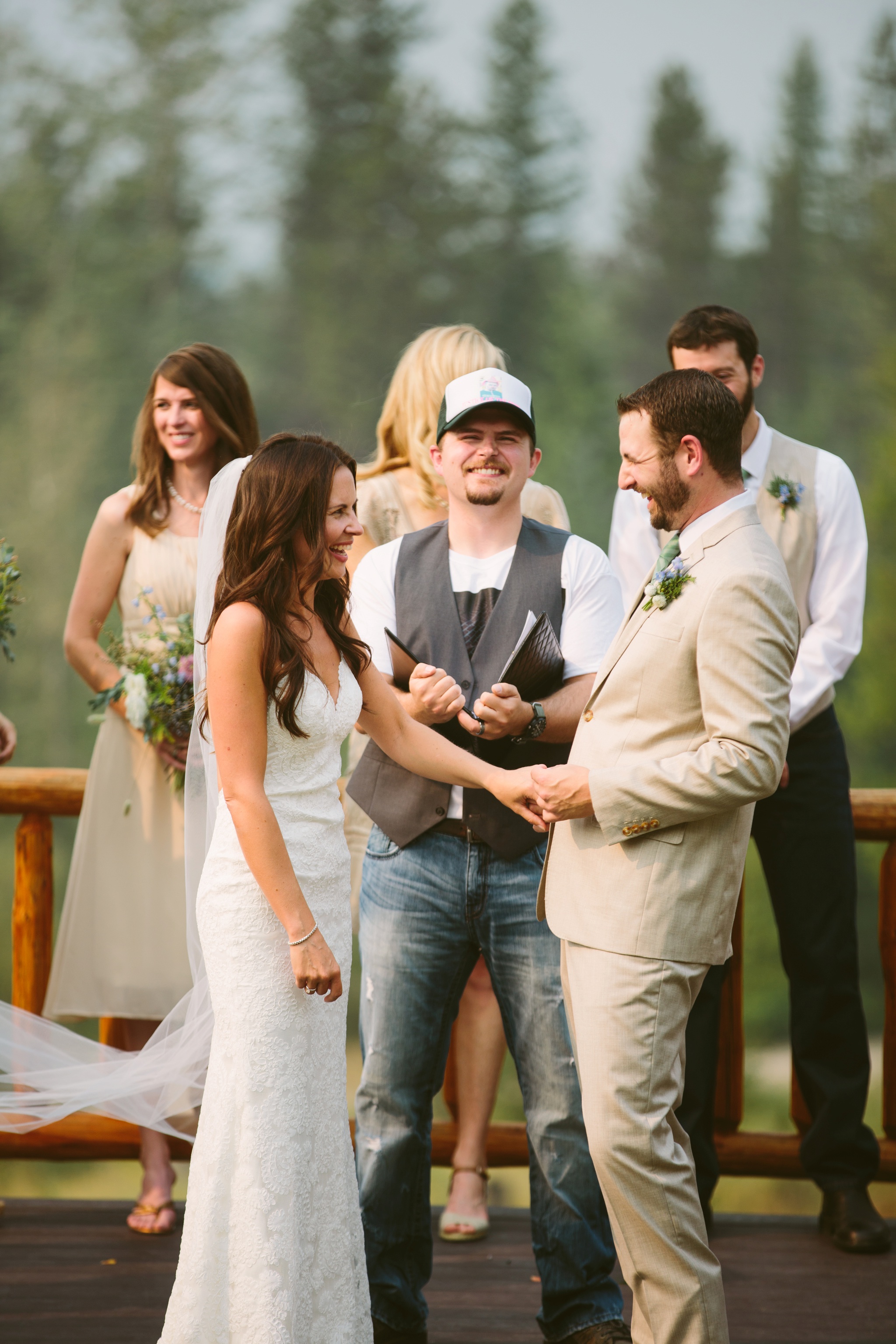 West Glacier National Park Outdoor Raft Center Wedding Ceremony Bride and Groom Laughing