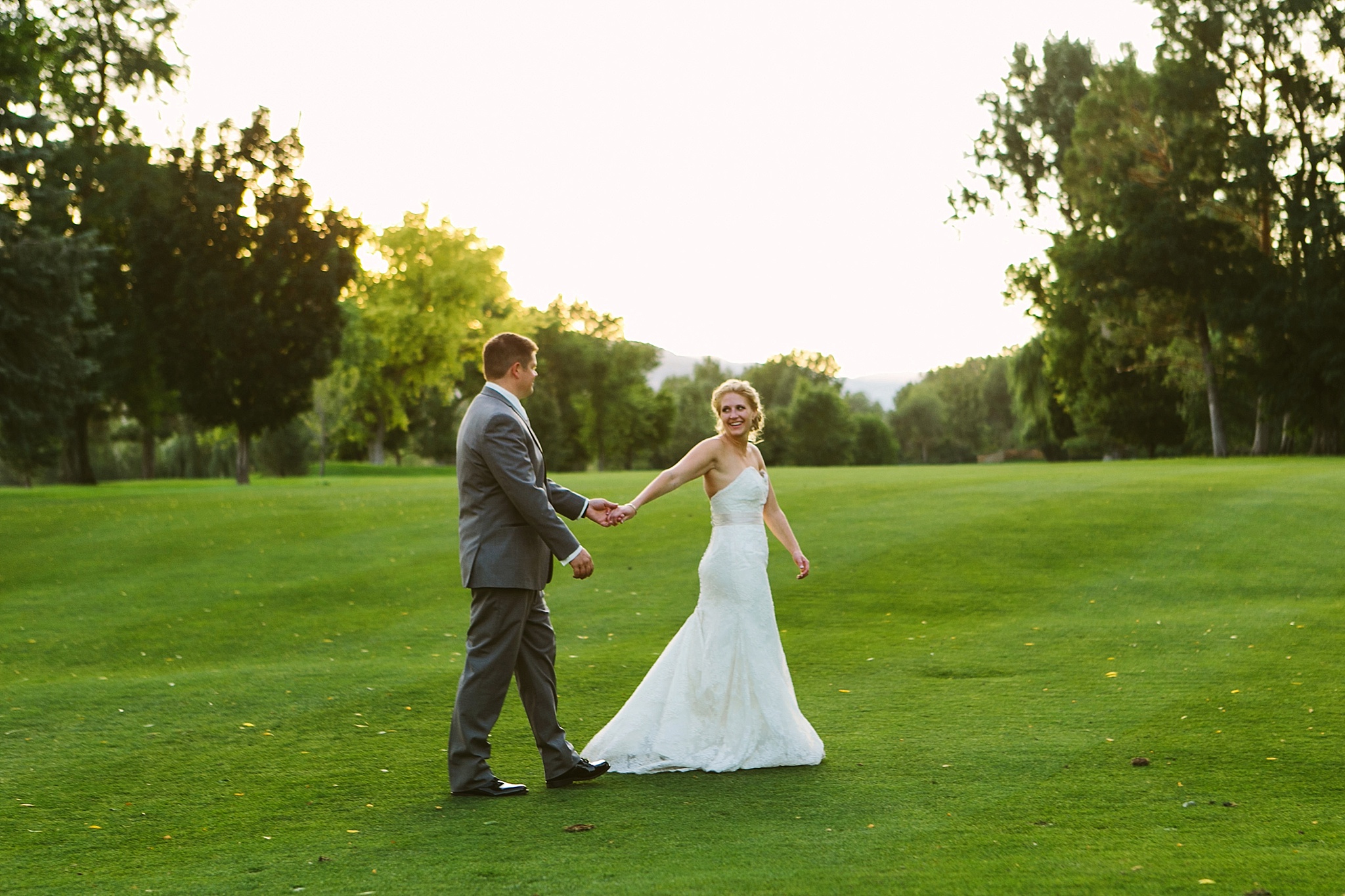 Missoula Country Club Wedding Photos Couple Holding Hands at Sunset