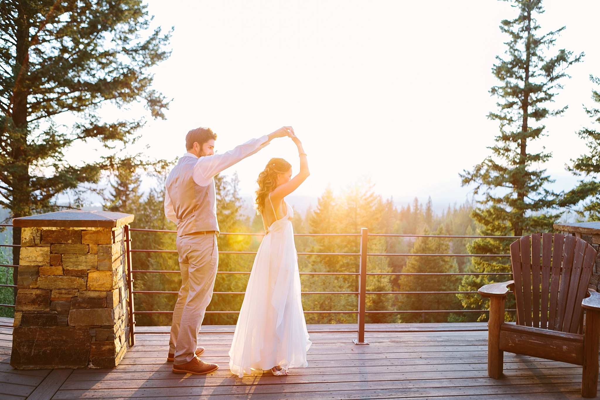 Sandpoint Idaho golf course wedding couple dancing on the porch at sunset