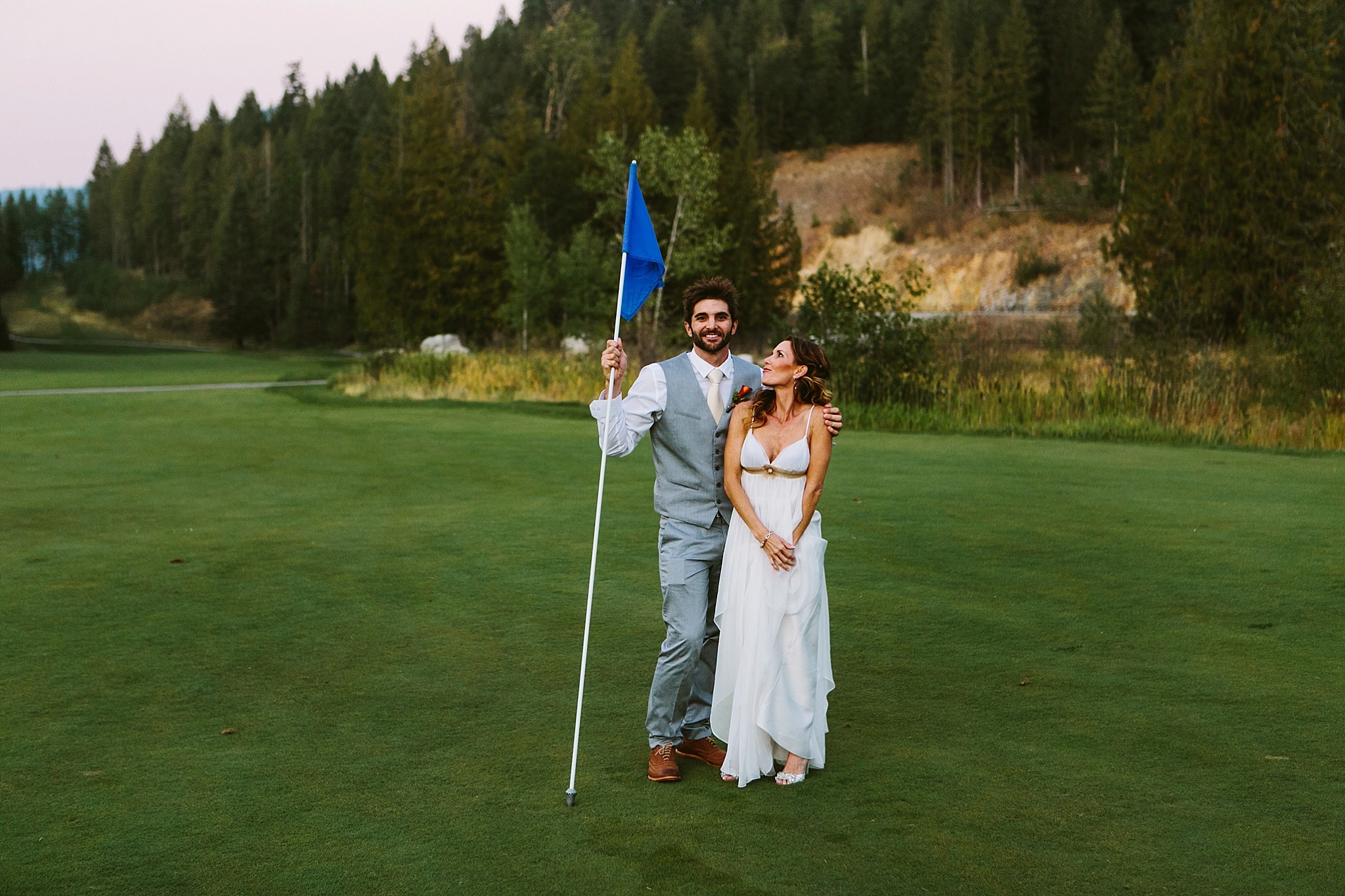 Sandpoint Idaho golf course wedding photo couple embracing