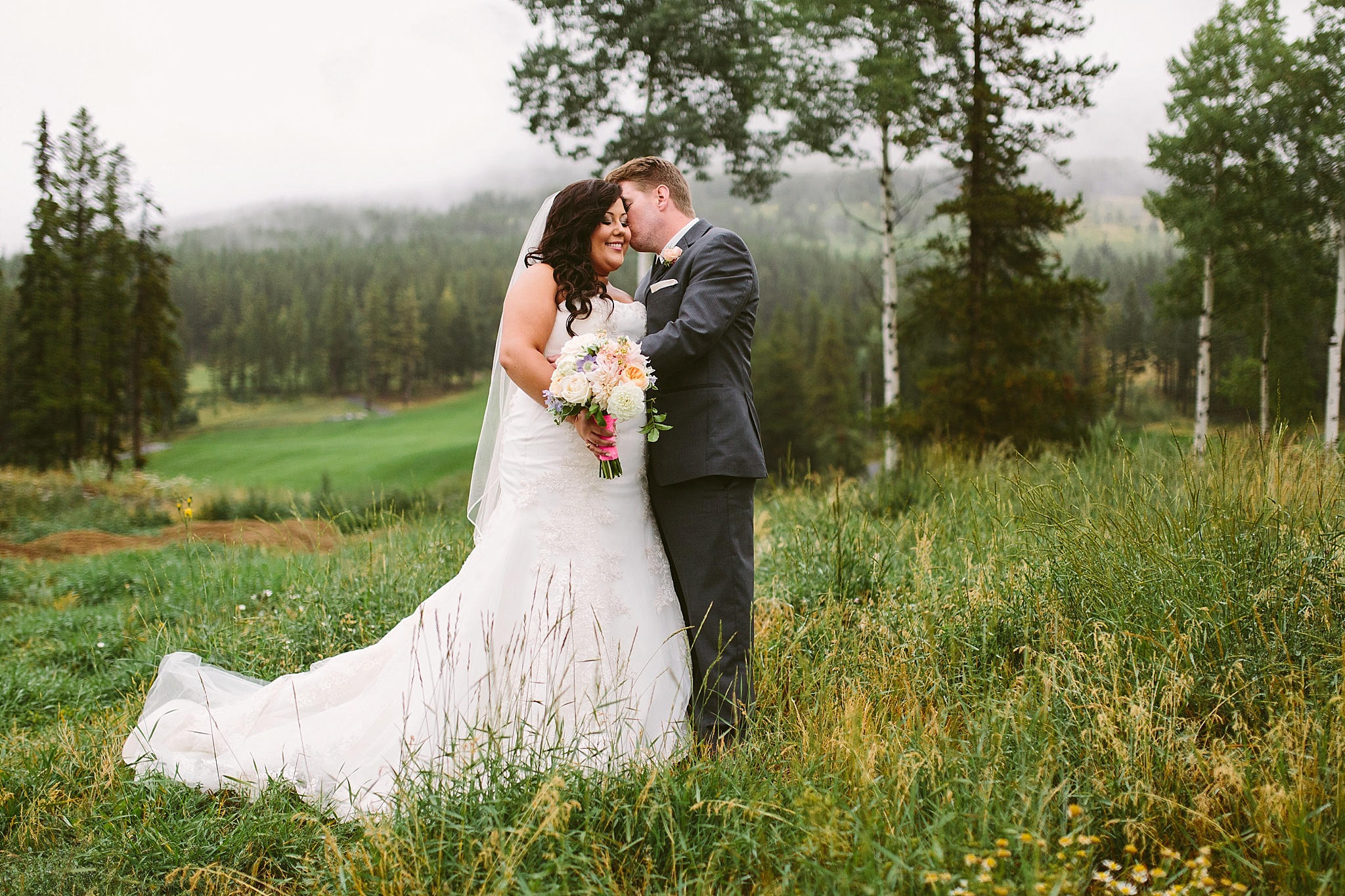 Silvertip Resort Canmore Alberta Wedding Photos Couple Kissing