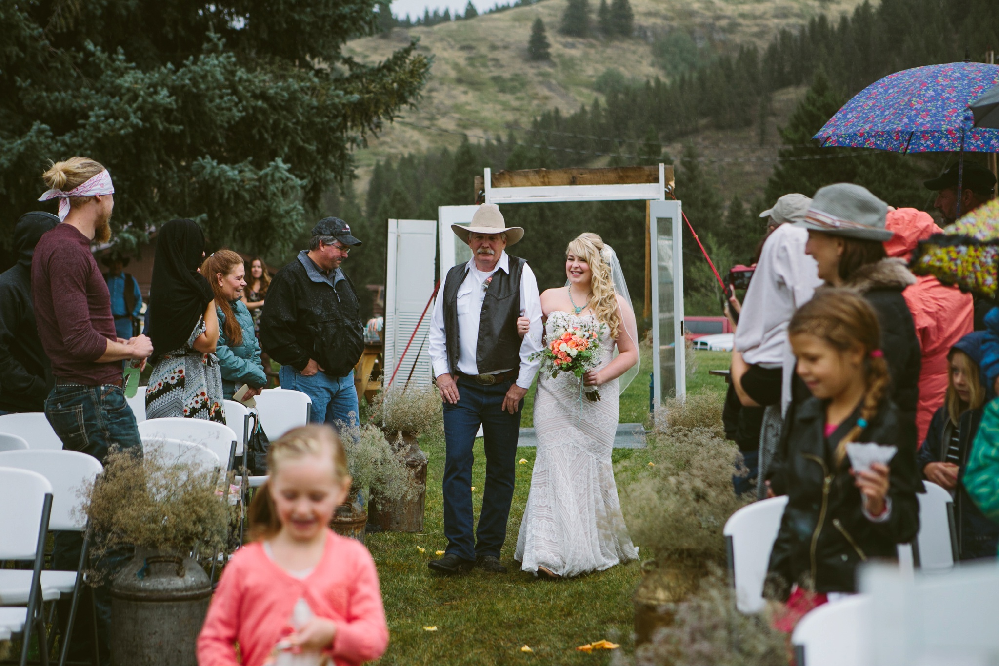 Arrowpeak Lodge Great Falls MT Wedding Photos Bride Walking Aisle in Rain