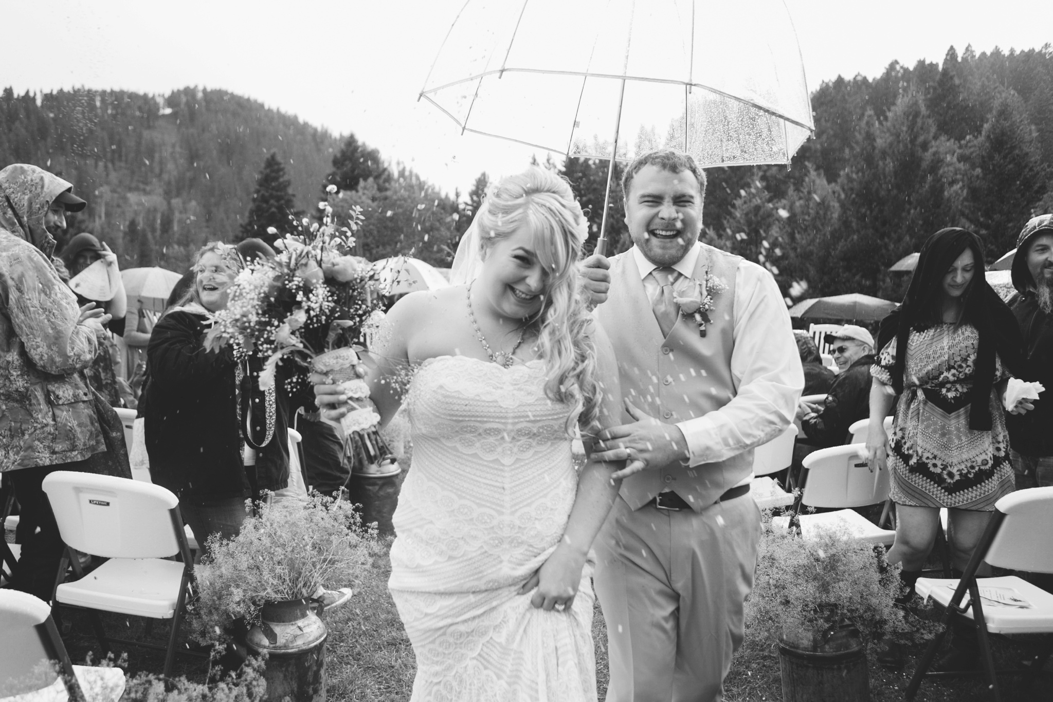 Arrowpeak Lodge Great Falls MT Wedding Photos Couple Laughing in Rain
