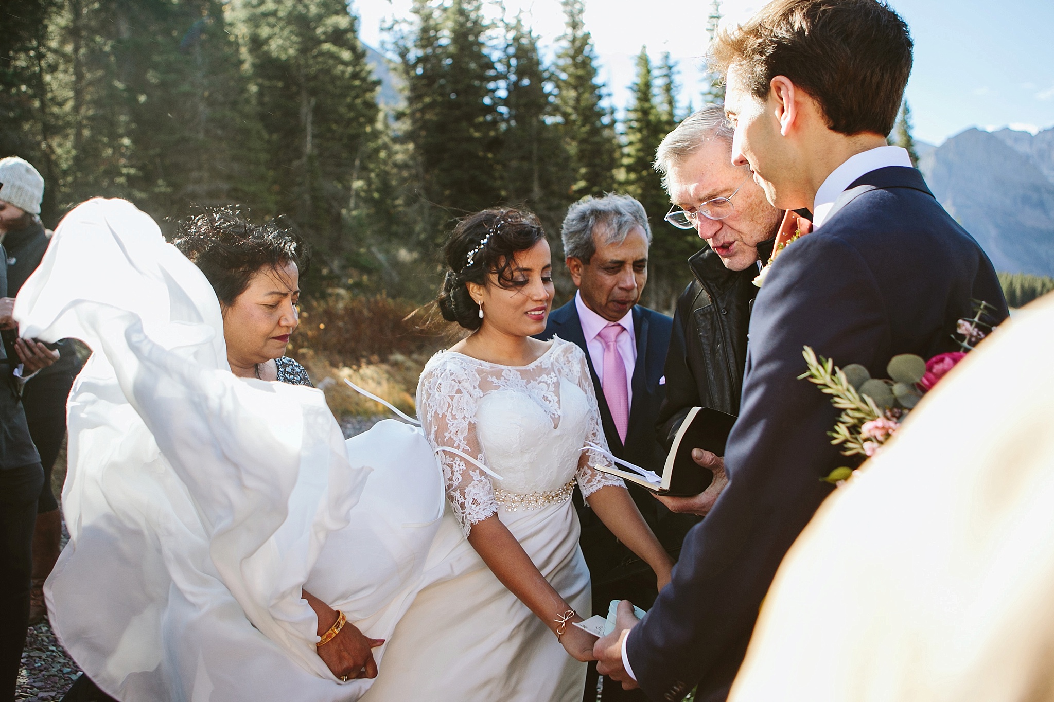 Josephine Lake Glacier National Park Elopement Ceremony Couple Holding Hands