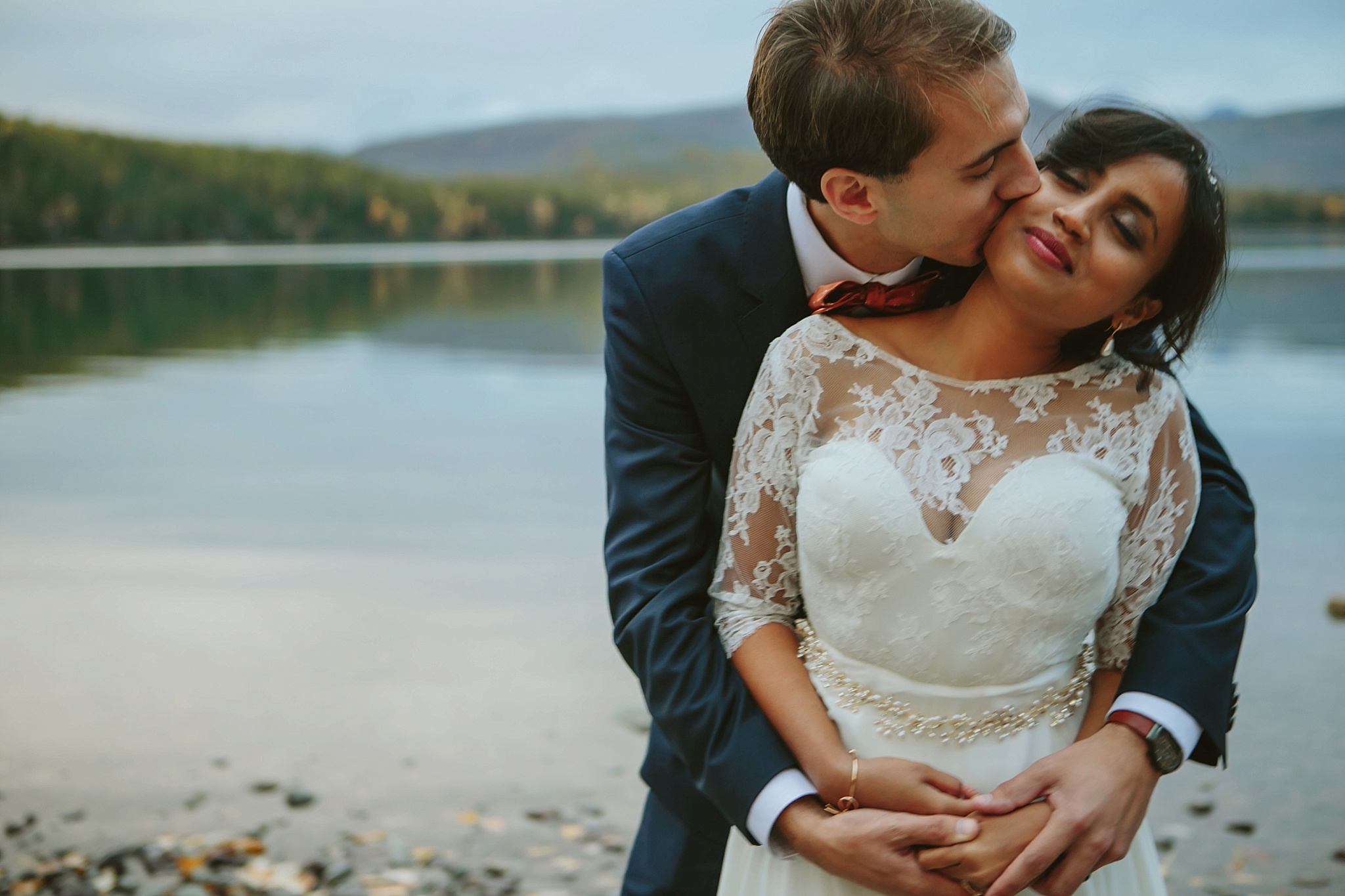 Glacier National Park Wedding Photos Couple at Lake McDonald Kissing