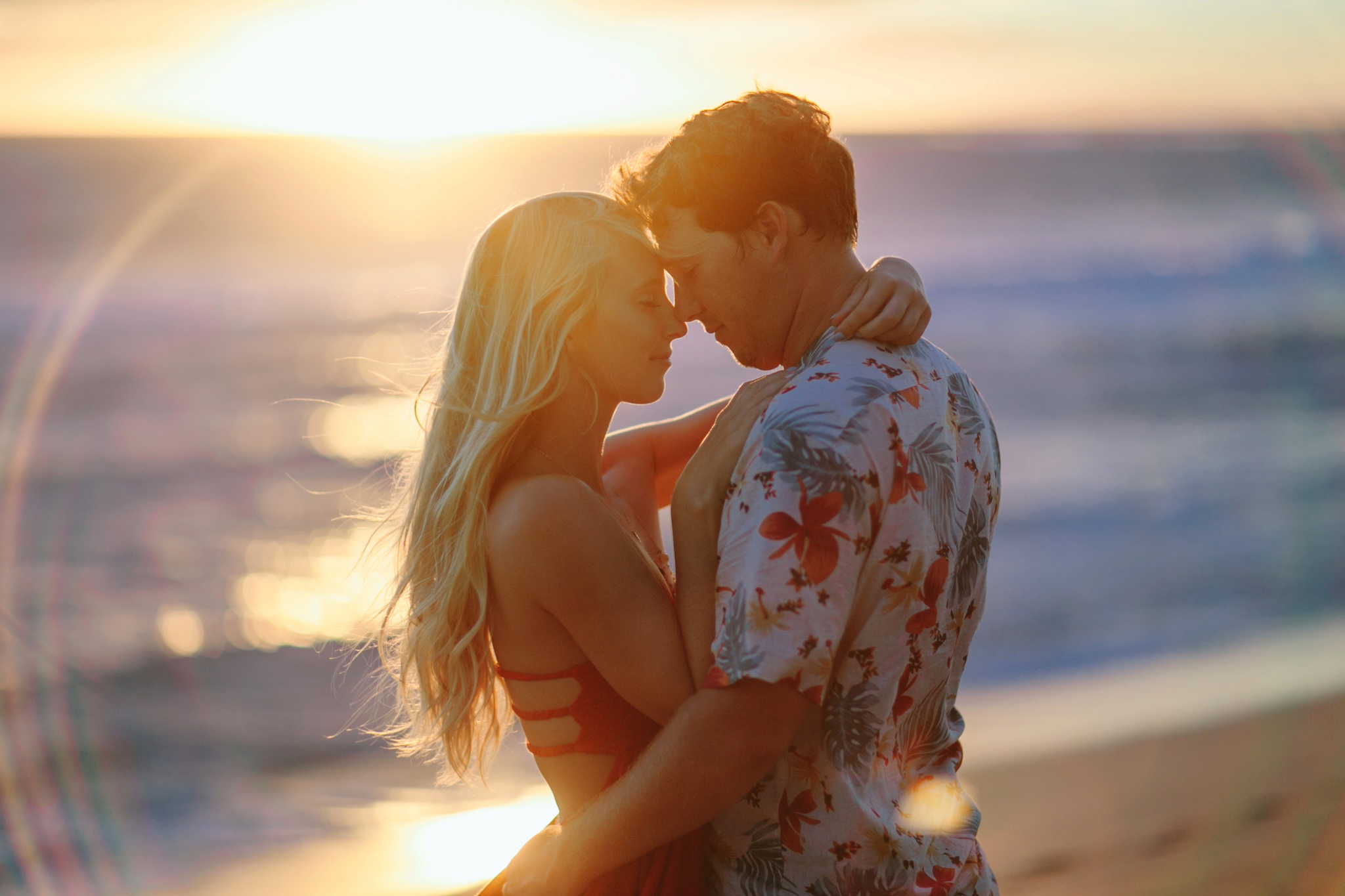 Kauai HI Beach Engagement Photos Couple Hugging at Sunset