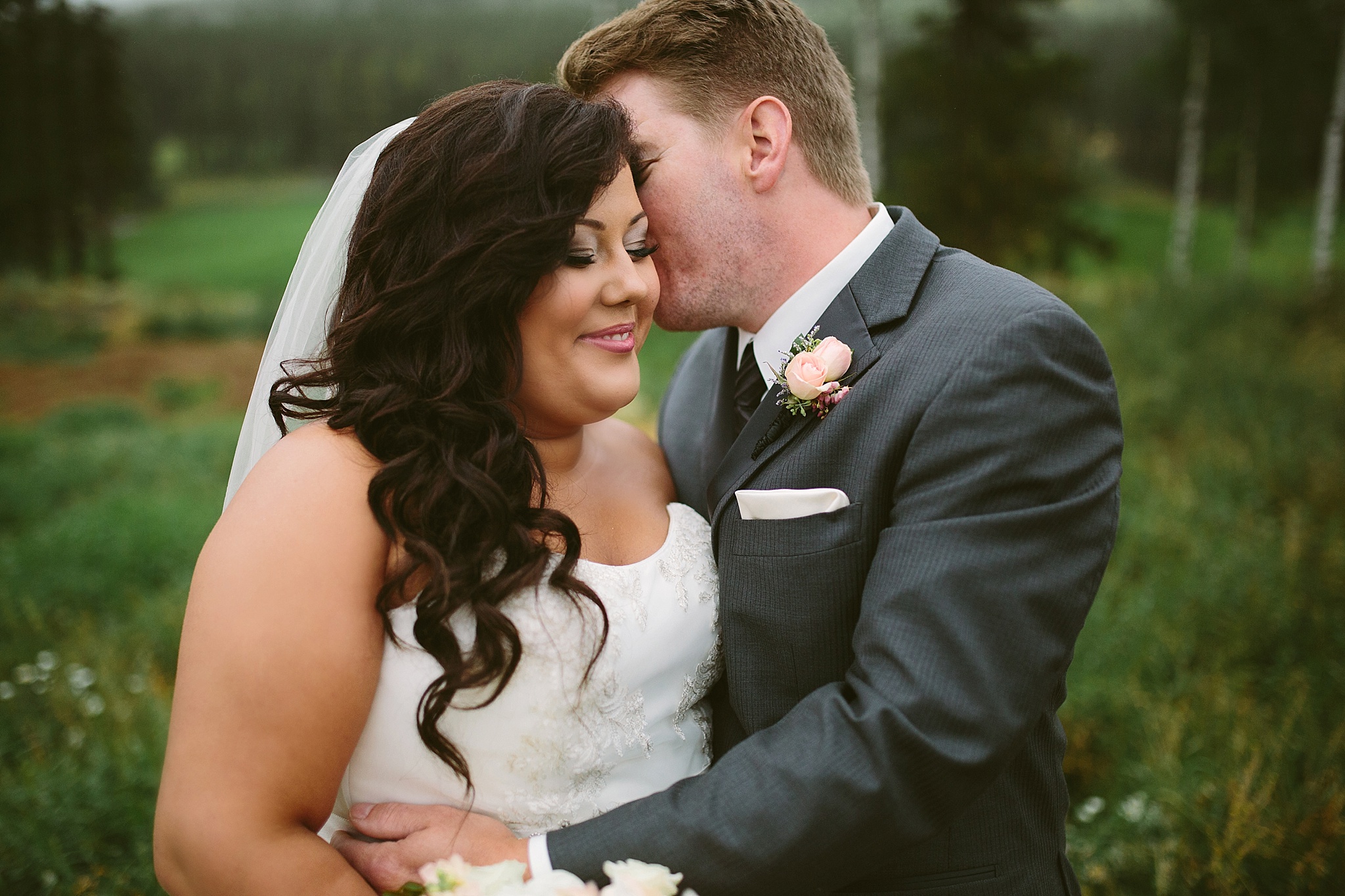 Silvertip Resort Canmore Alberta Wedding Photos Bride and Groom Kissing