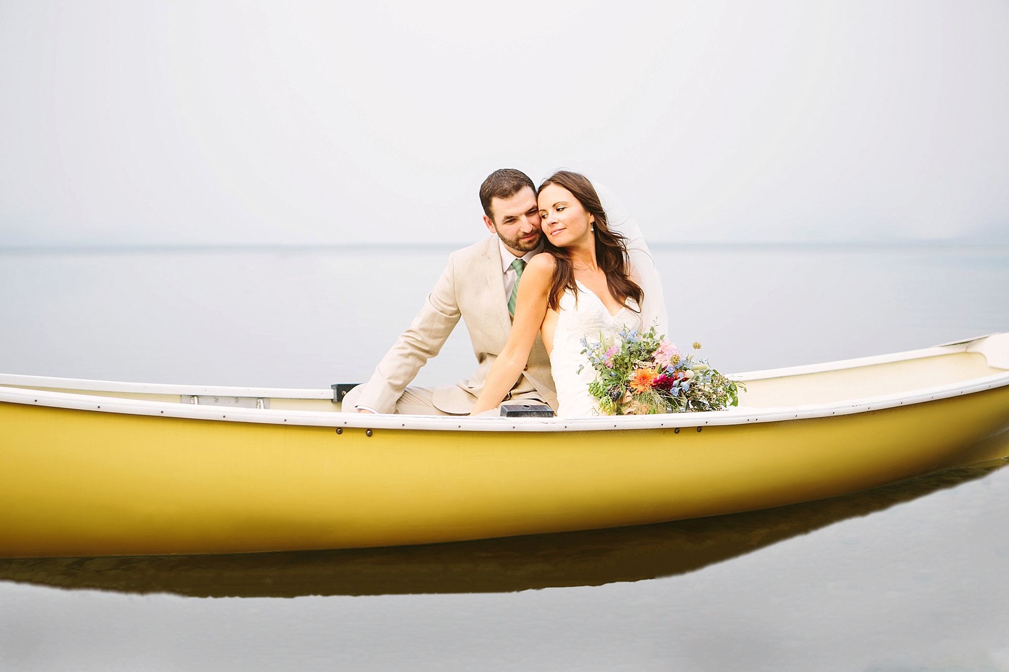 Glacier National Park Wedding Photos Bride and Groom in Boat on Lake McDonald