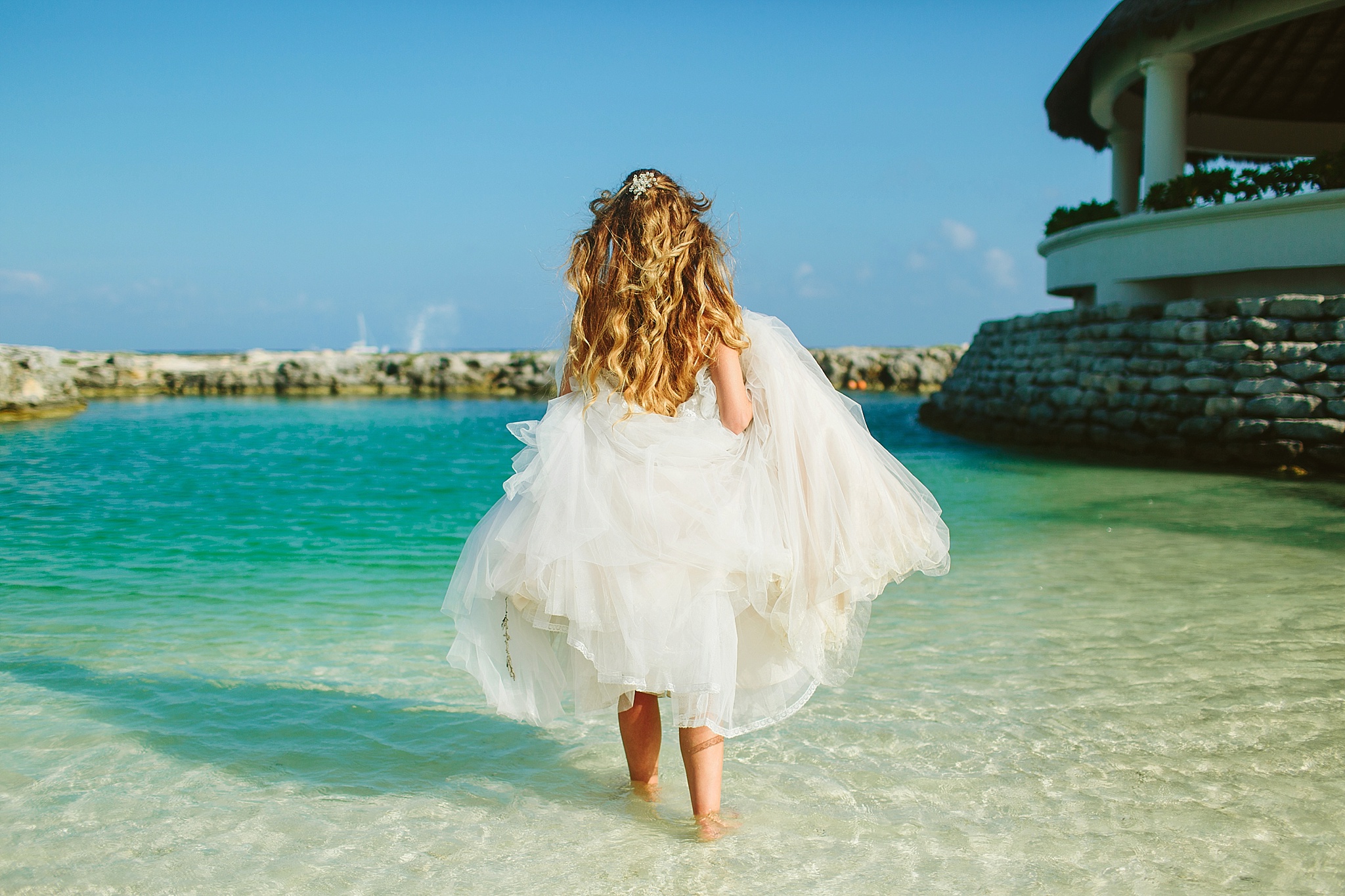 Hard Rock Riviera Mexico Puerto Adventuras Wedding Photos Bride Walking in the Ocean