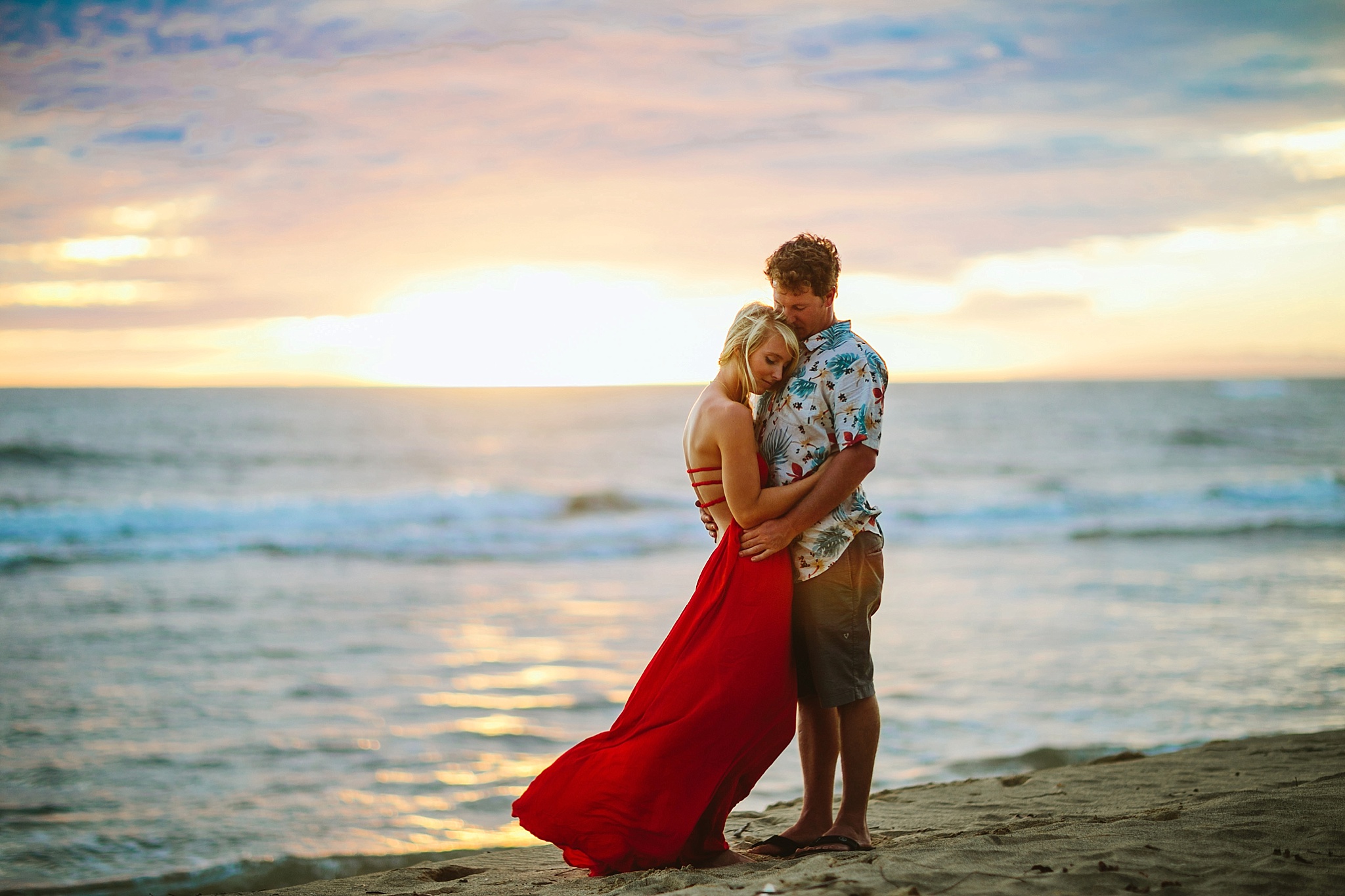 Kekaha Beach Kauai HI Engagement Photos Bride and Groom Hugging at Sunset