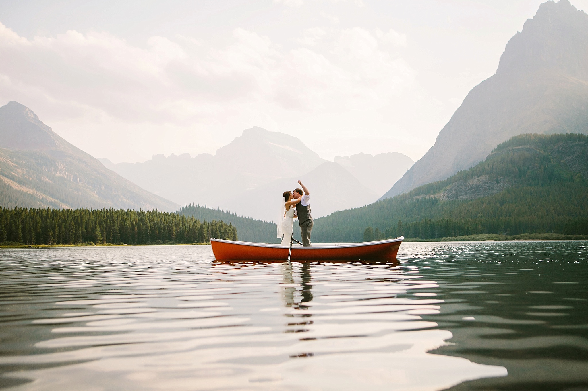 Many Glacier National Park Elopement Photos Bride and Groom Kissing in Canoe