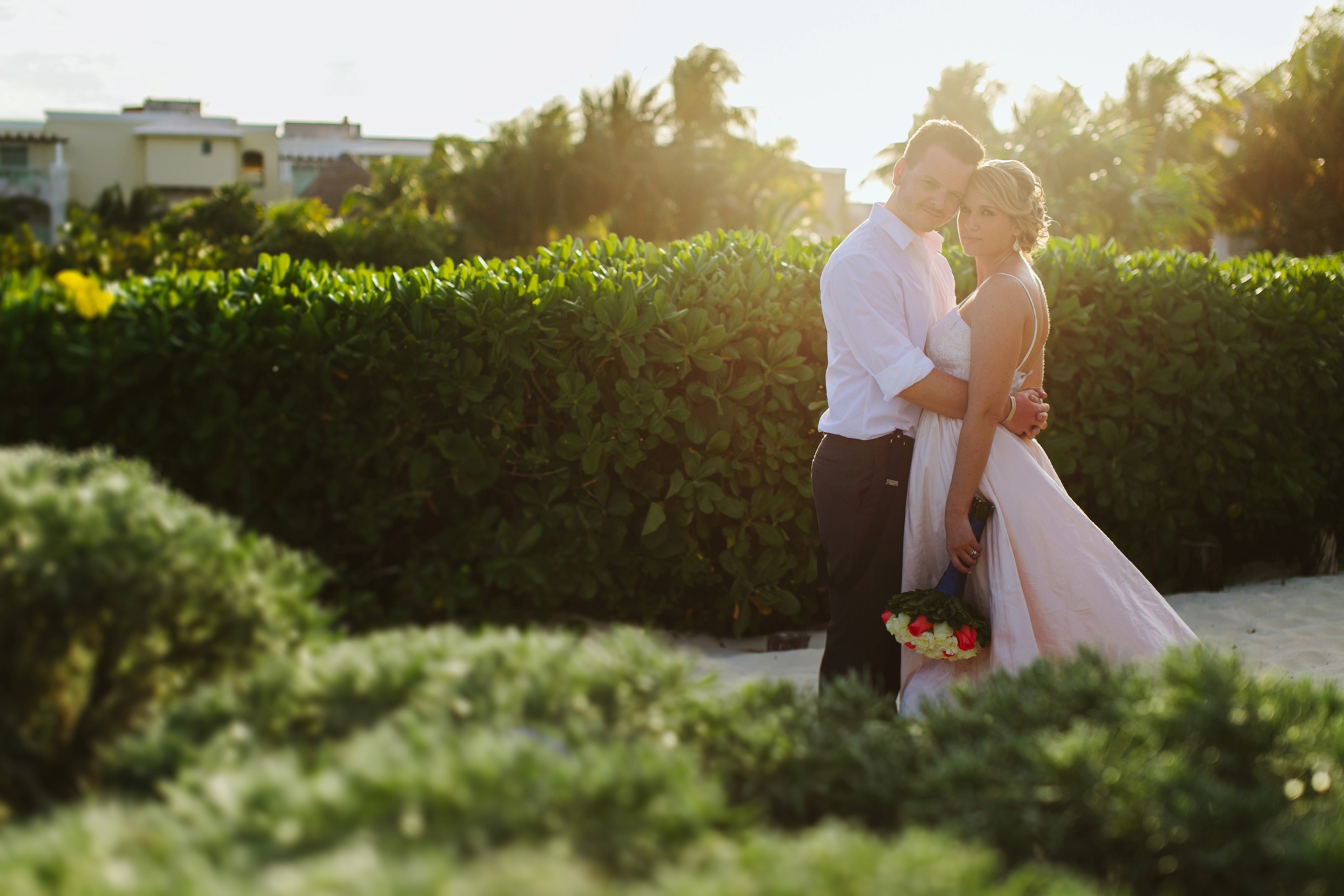 Moon Palace Resort Cancun Mexico Wedding Photos Bride and Groom Hugging at Sunset