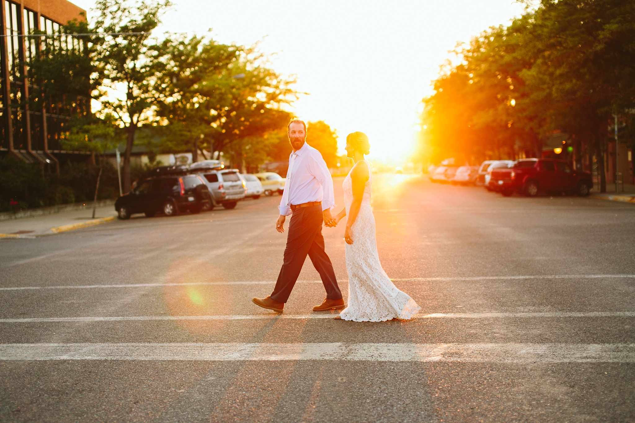 Missoula MT Downtown Wedding Photo Couple Holding Hands at Sunset
