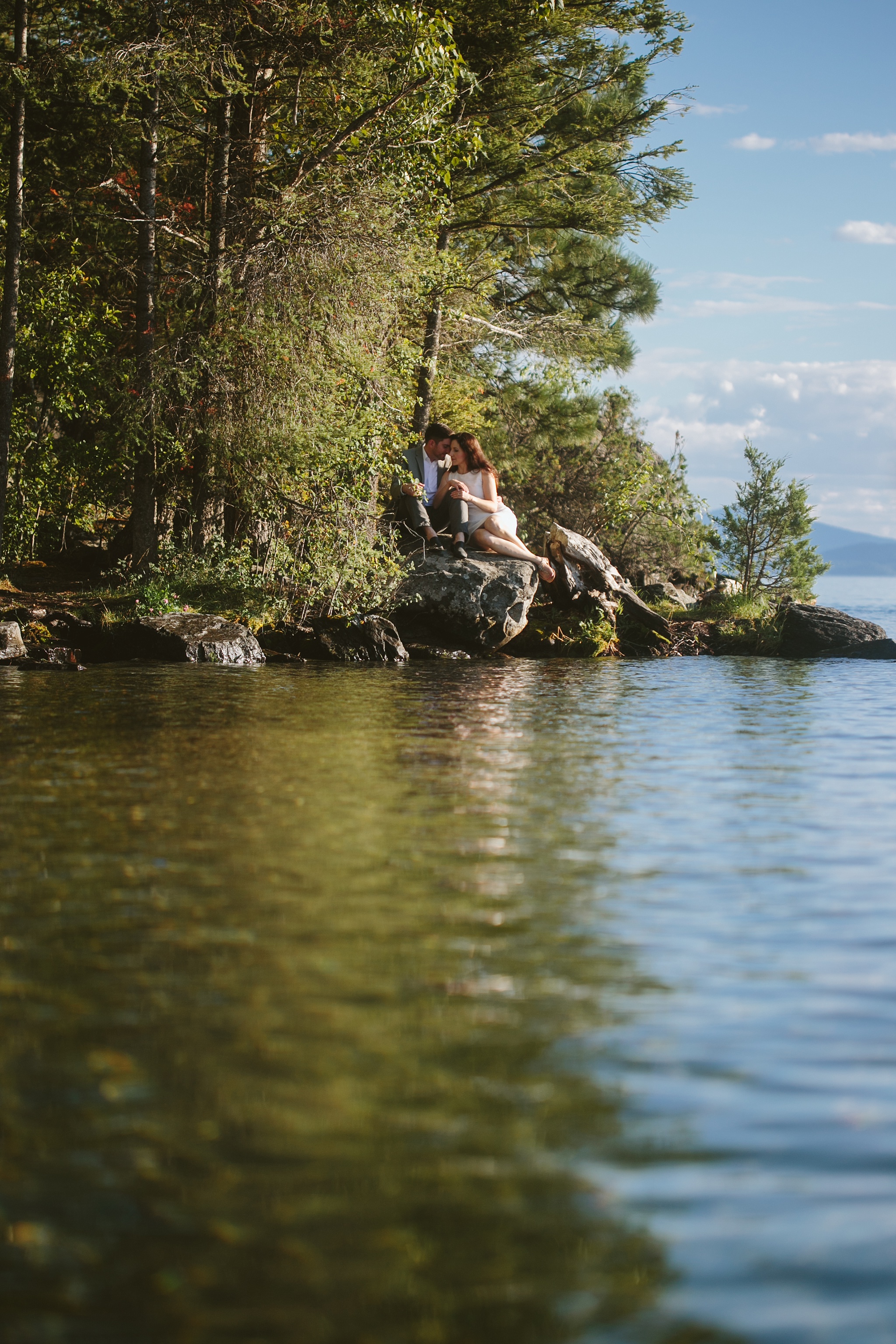 Bigfork MT Flathead Lake Engagement Photo Wayfarer Park Couple Cuddling