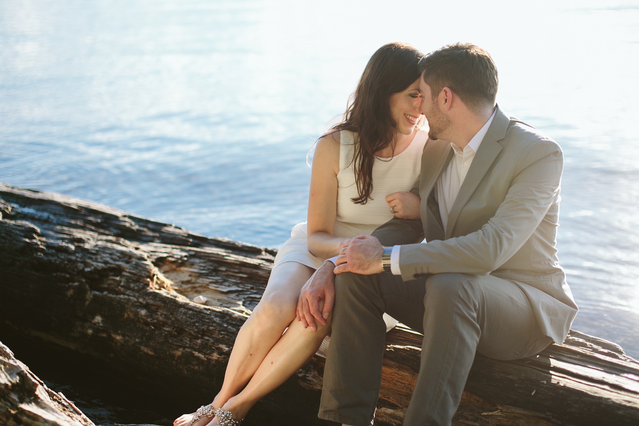 Bigfork MT Flathead Lake Engagement Photo Wayfarer Park Couple Cuddling