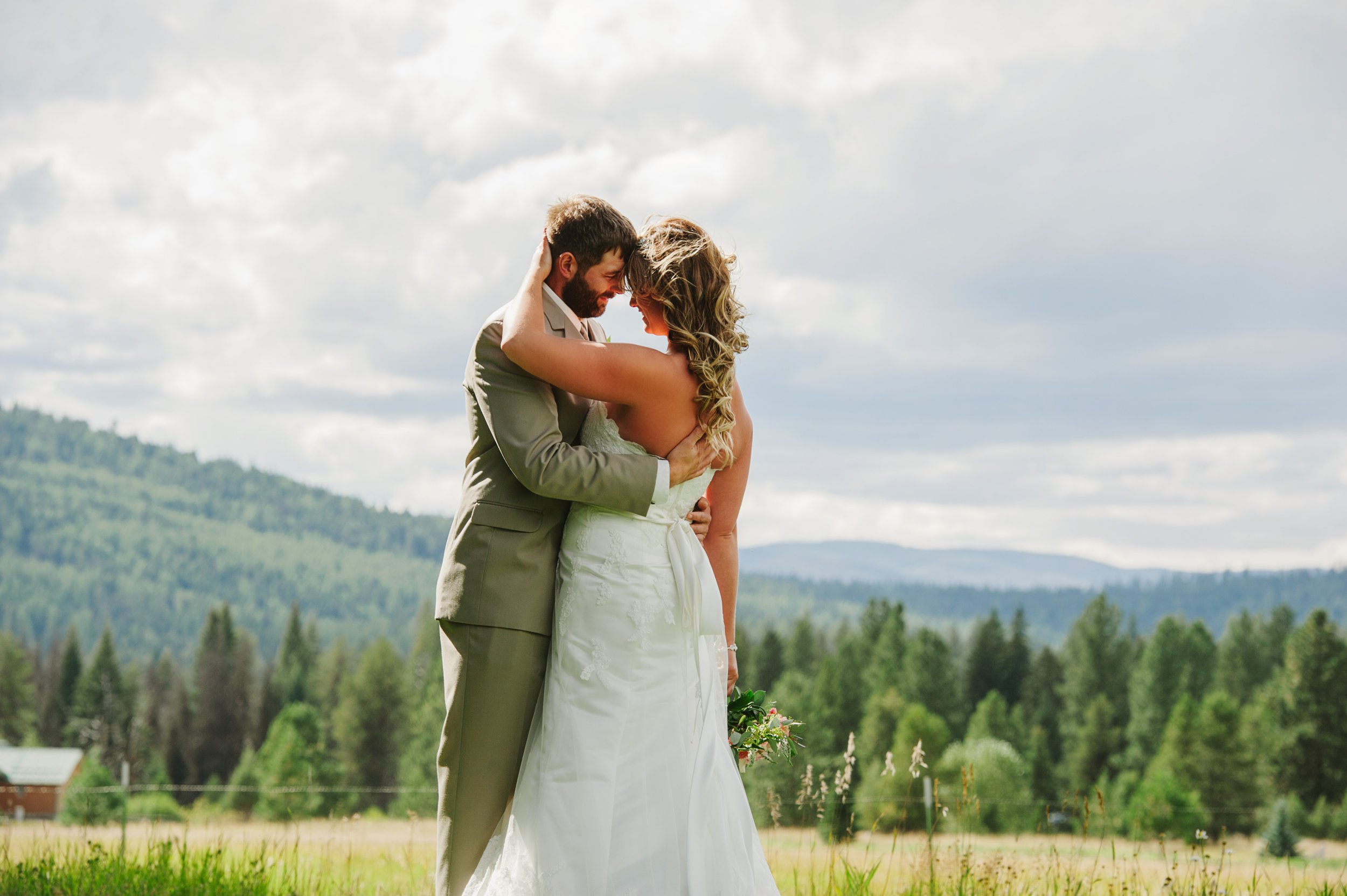 Double Arrow Resort Seeley Lake MT Wedding Photos Couple Kissing