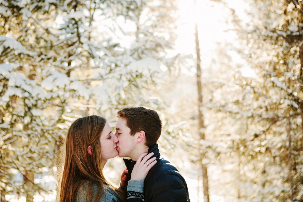 Seeley Lake MT Winter Engagement Photos Couple Kissing