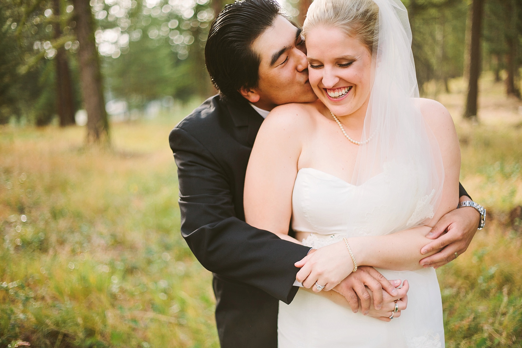Missoula MT Backyard Forest Wedding Couple Kissing
