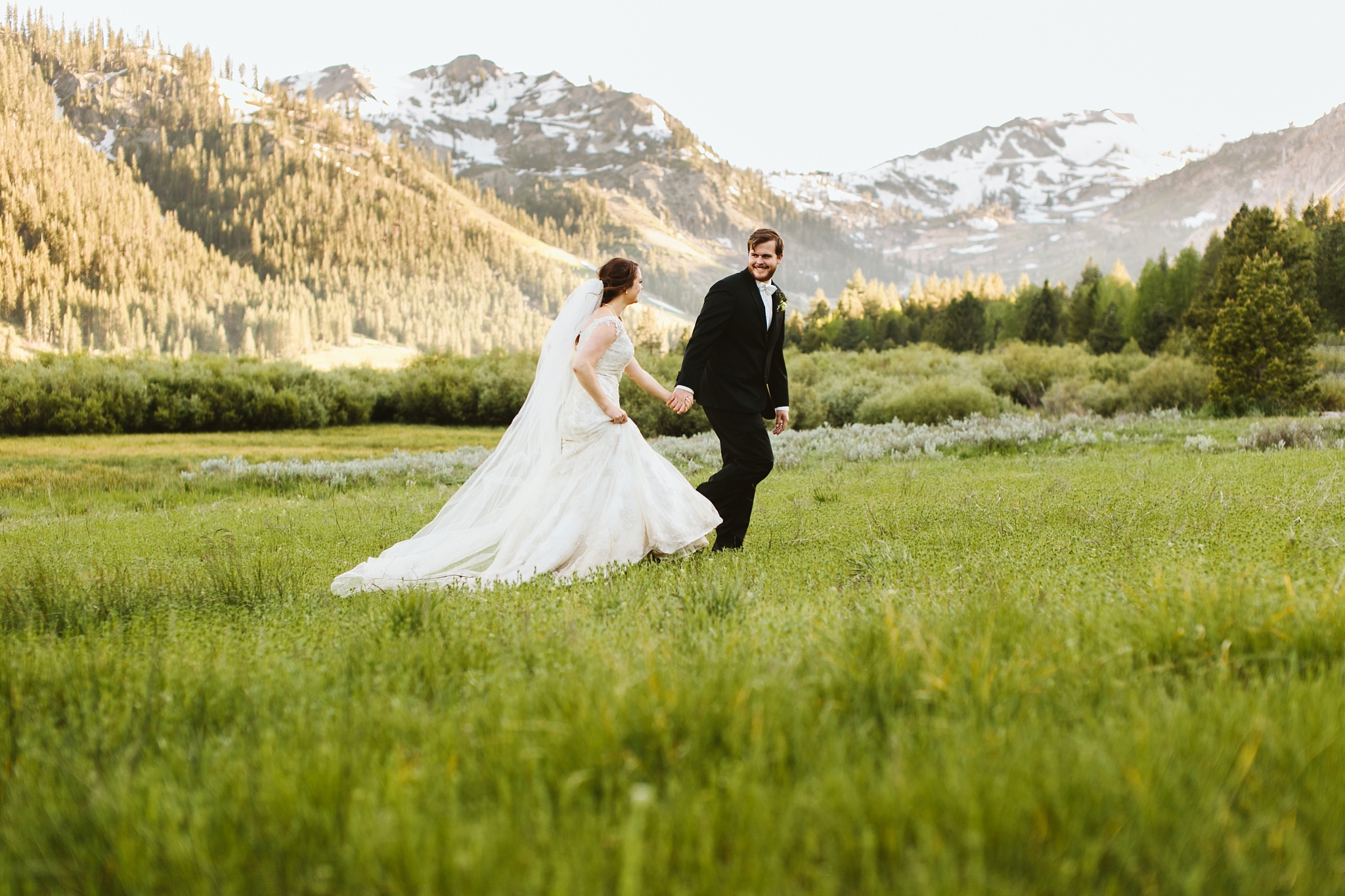Squaw Valley Lake Tahoe CA Wedding Photo Bride and Groom Holding Hands