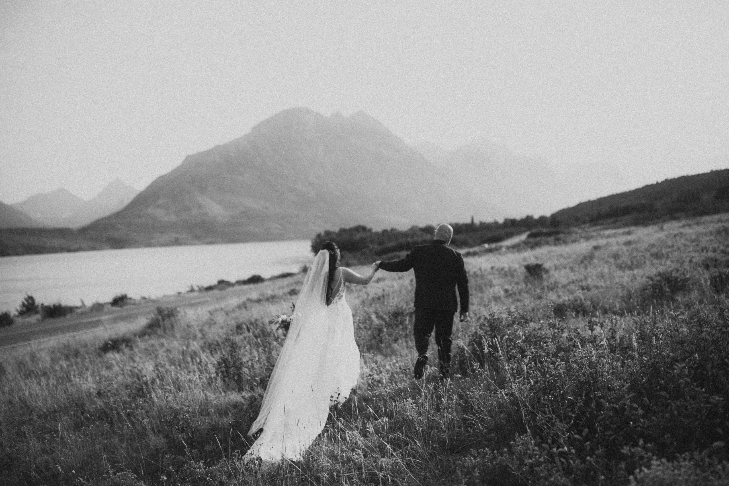 Wedding in wildflower field in the mountains of Glacier National Park